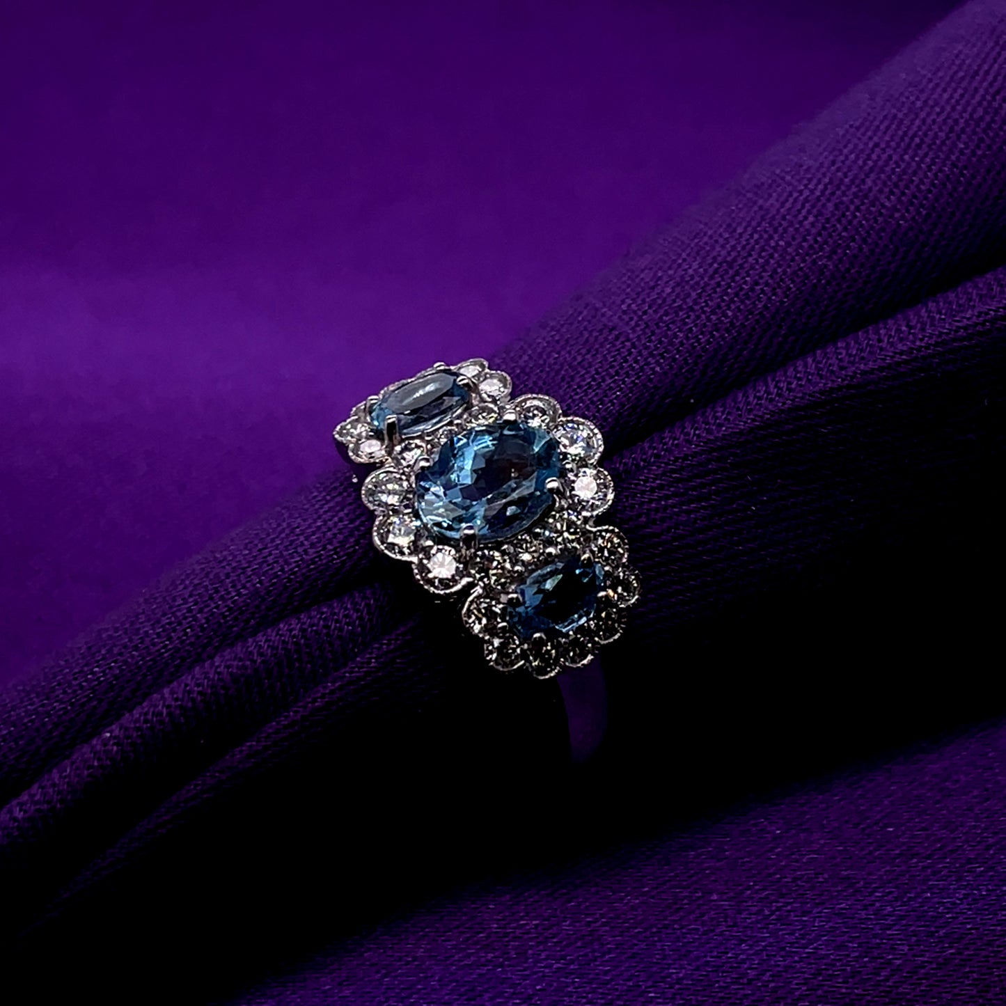 18ct White Gold Aquamarine & Diamond Halo Three Stone Ring WRX068
